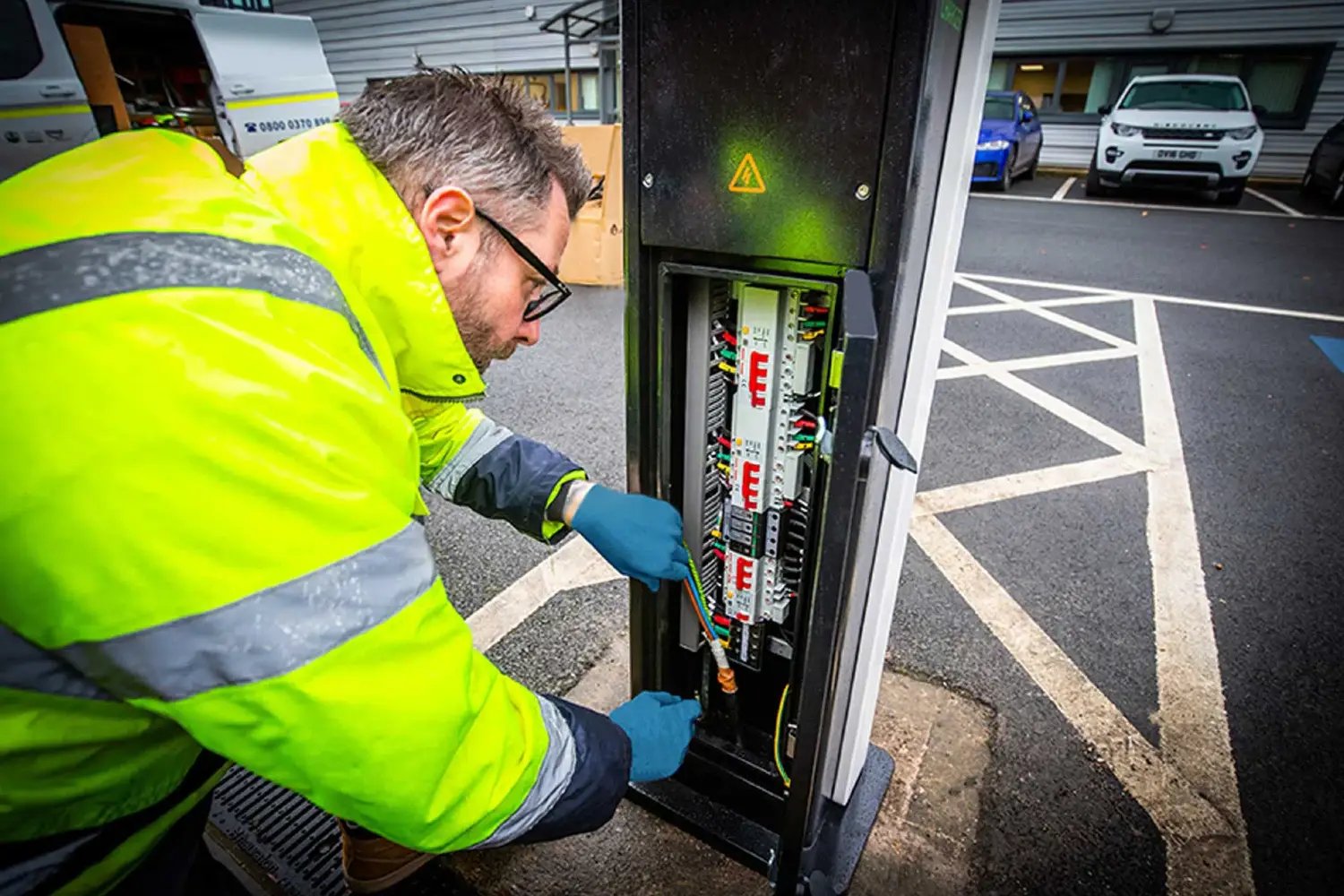 engineer fixing ev charging point